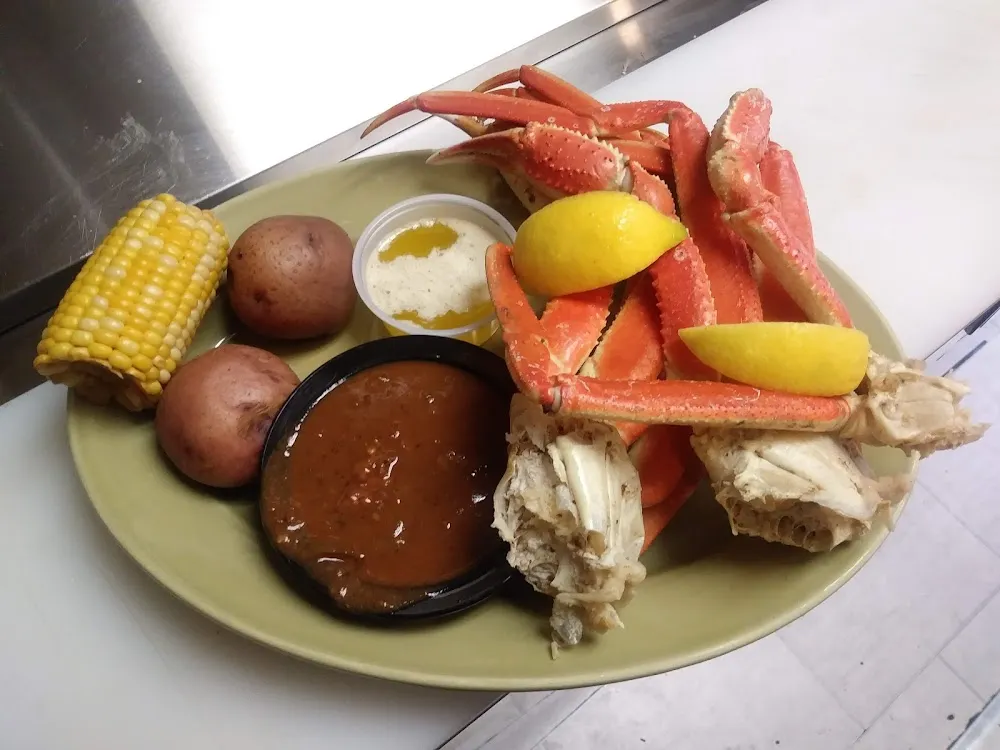 Crab Legs with Hot Red Potatoes and Hot Corn with a Side of Shrimp and Sausage Gumbo